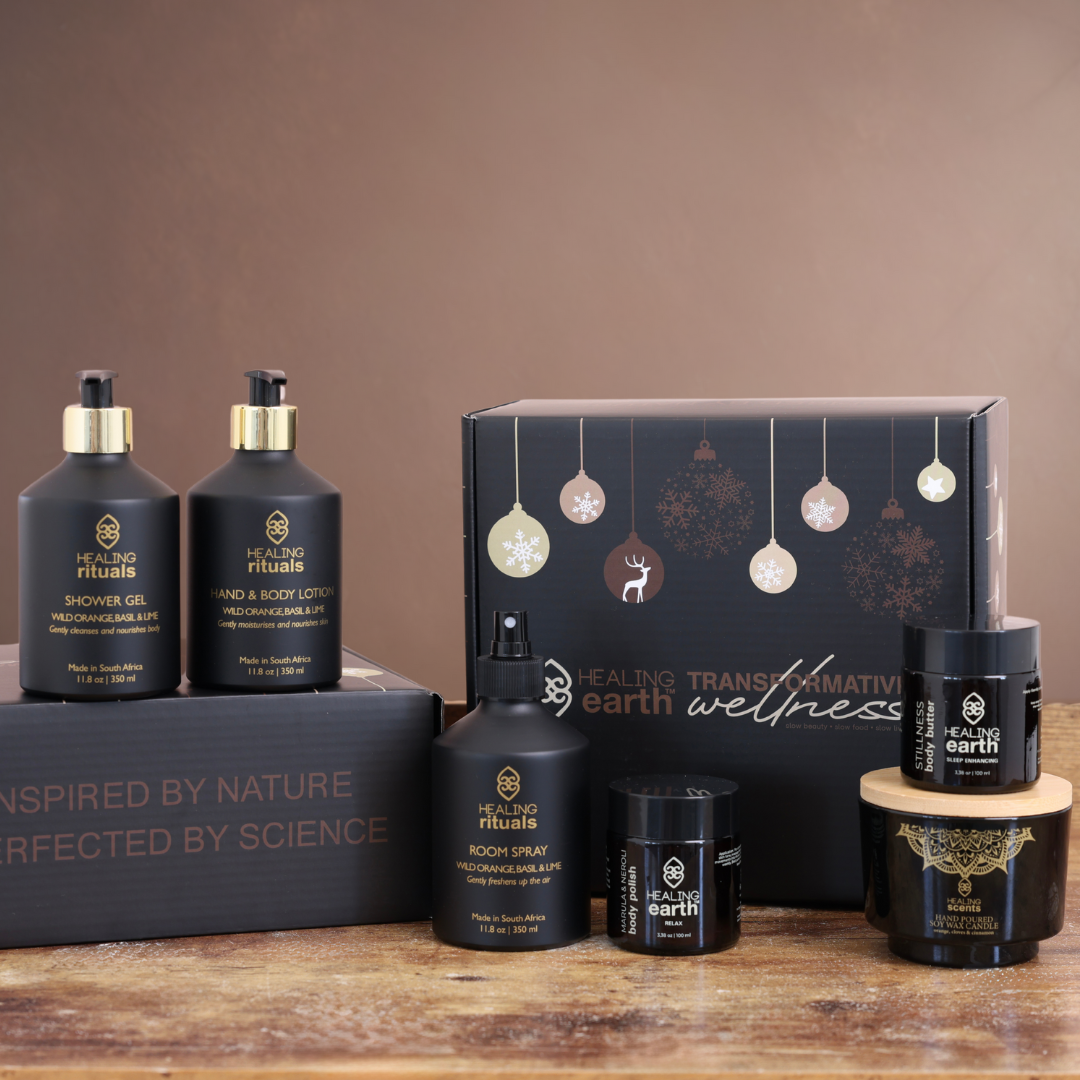 Healing Earth wellness products on a wooden surface with a brown background