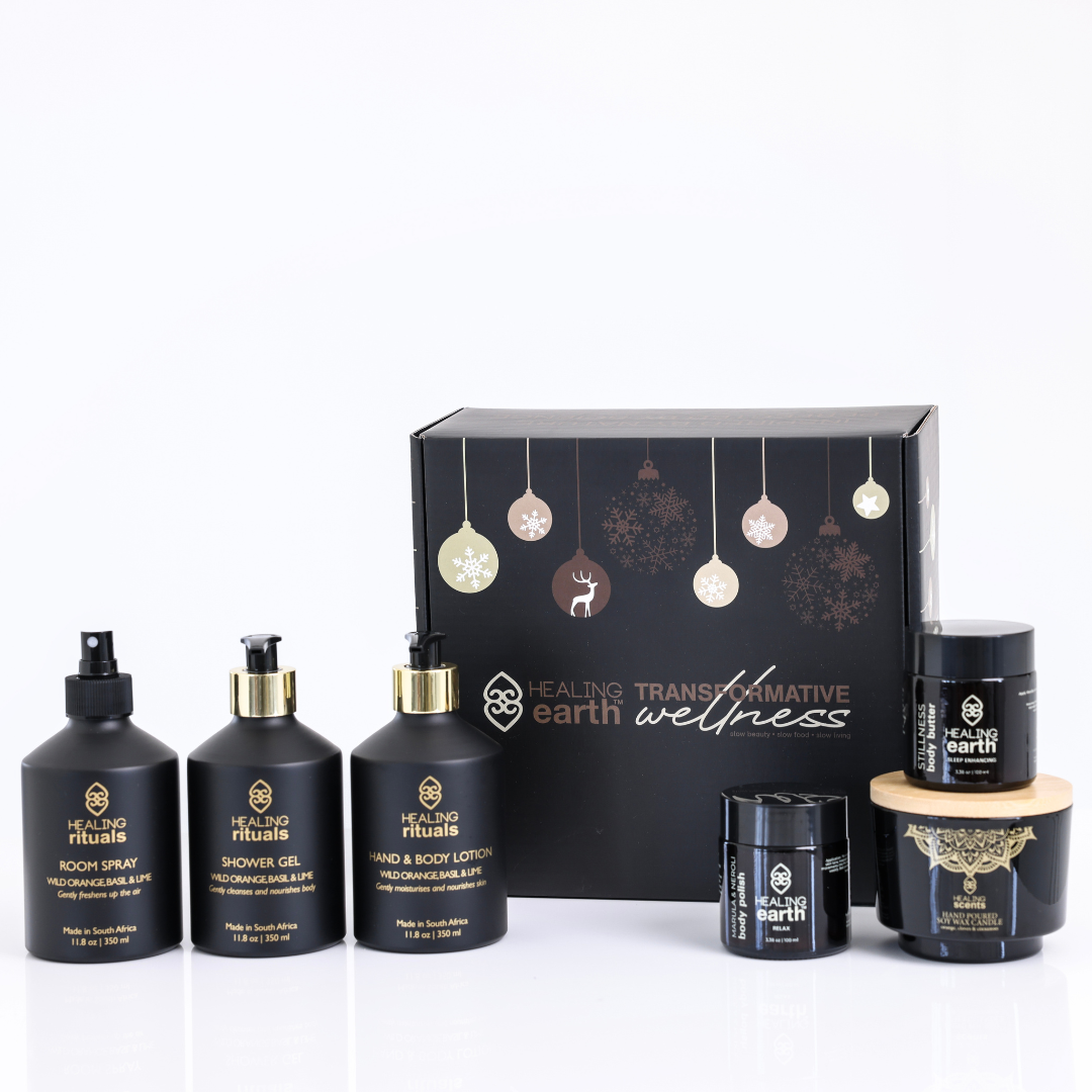Set of black beauty products with 'Healing Earth' branding on a white background